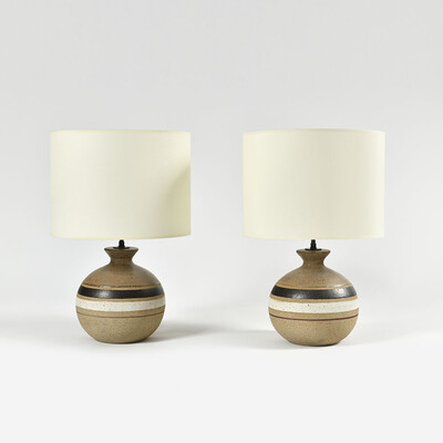 a pair of ball shaped white red and earth color frieze Bruno Gambone lamps