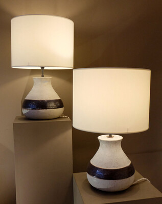 a pair of white and earth color frieze Bruno Gambone lamps