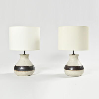 a pair of white and earth color frieze Bruno Gambone lamps