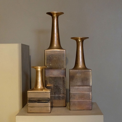 a set of three bronze Gambone vases